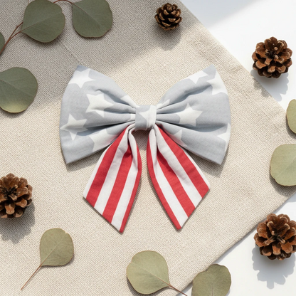 Large bow with gray stars and red and white stripes on a white background