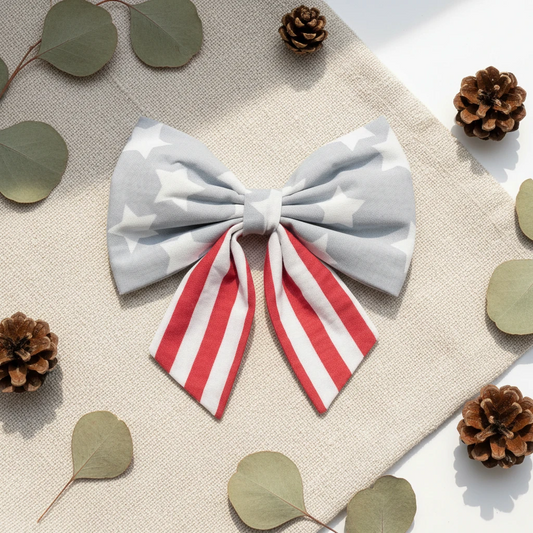 Large bow with gray stars and red and white stripes on a white background